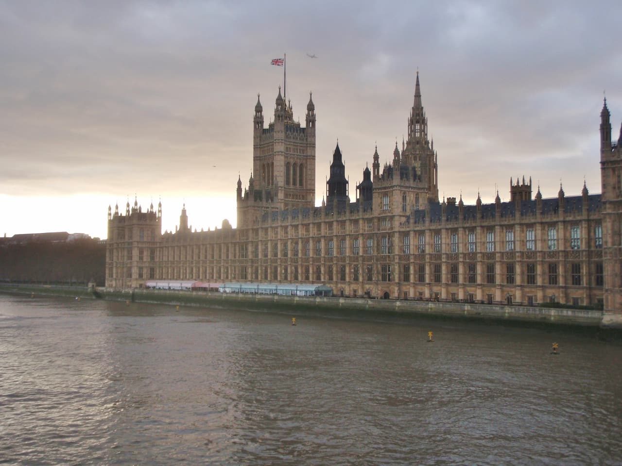 The Palace of Westminster (Houses of Parliament) viewed across the River Thames, London.